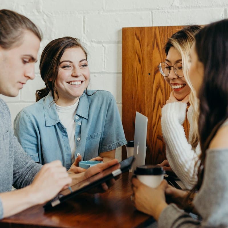 Colleagues chatting over coffee